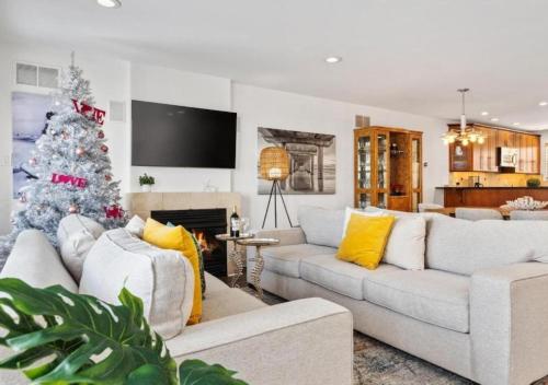 a living room with a christmas tree in it at PERFECT 5 STAR - Chelsea Harbor House in Atlantic City