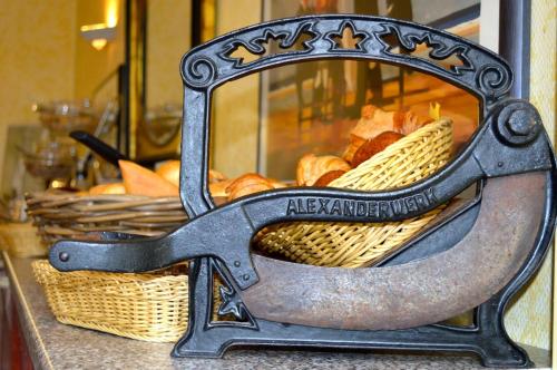 a basket of bread and a basket of pastries at Hotel Weinhaus Hoff in Bad Honnef am Rhein
