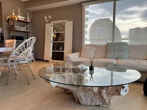 a living room with a coffee table and a couch at Acapulco Diamante La Isla Residences & Spa in Acapulco
