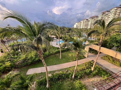 an aerial view of a resort with palm trees at Acapulco Diamante La Isla Residences & Spa in Acapulco