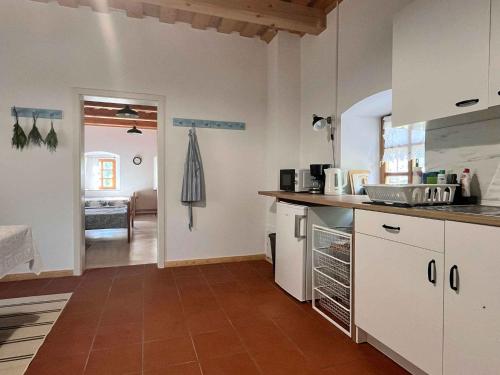 a kitchen with white cabinets and a counter top at Holiday home in Semic - Kranjska (Krain) 51757 in Semič