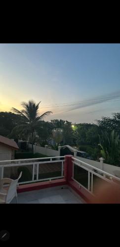 a view of the sunset from the balcony of a house at Paradise Estate in Gambia in Old Yundum