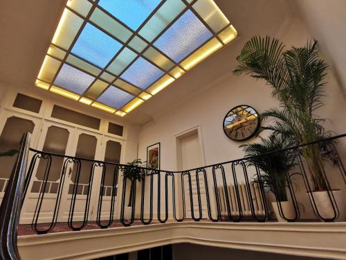 a building with a staircase with a skylight at Maison d'hôtes de Xavier in Brussels