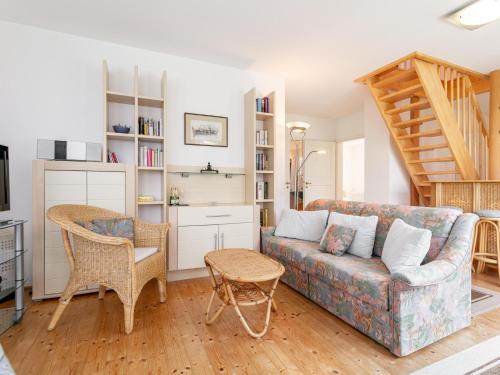a living room with a couch and a chair at Ferienidyll Kufstein in Kufstein