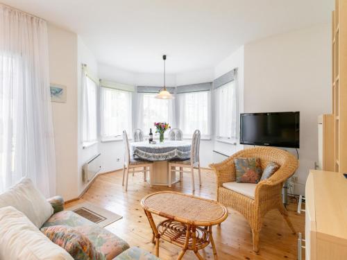 a living room with a table and chairs at Ferienidyll Kufstein in Kufstein