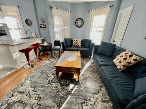 a living room with a couch and a coffee table at Kailyn Apartment Boston, Massachusetts in Boston