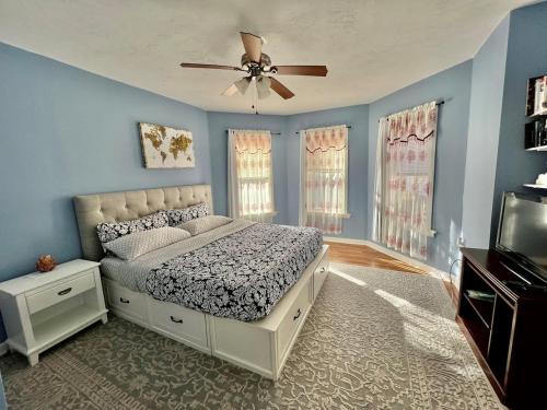 a bedroom with a bed and a ceiling fan at Kailyn Apartment Boston, Massachusetts in Boston