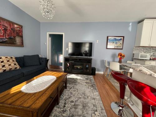 a living room with a couch and a table at Kailyn Apartment Boston, Massachusetts in Boston