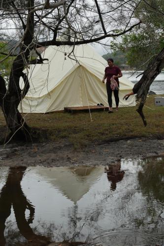a woman standing in front of a tent at Curve56 in Tuaran