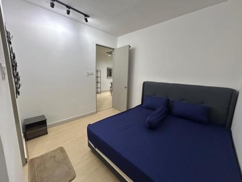 Ένα ή περισσότερα κρεβάτια σε δωμάτιο στο A&S Homestay at Prima Matang