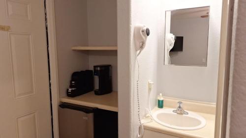a bathroom with a sink and a mirror at 82A Grand Canyon South Rim Studio Sleeps 2 in Valle