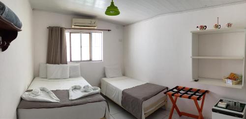 Postel nebo postele na pokoji v ubytování POUSADA LUATOUR Praia Pontal do Coruripe