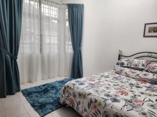 a bedroom with a bed and a window with curtains at D'Imar Homestay - Homestay Serendah in Serendah