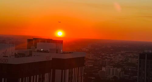 a view of the sunset from the top of a building at Miami Luxe Escape Best High Waterfront Views, City Lights, Pool, Spa Amazing location in Miami