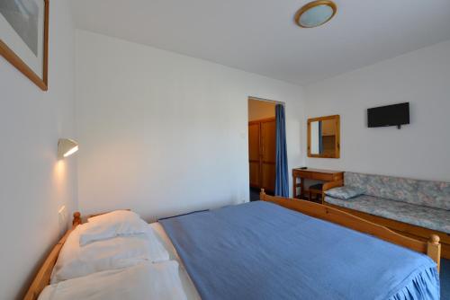 Кровать или кровати в номере Wellness Hotel Kakadu