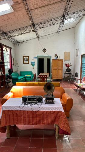 a living room with a couch and a table at CorpoAgro HJC in Sonsón