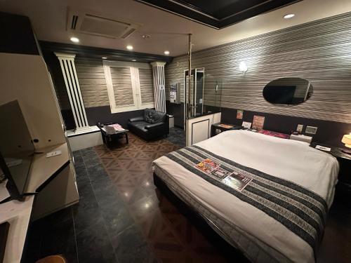 Postel nebo postele na pokoji v ubytování ホテルロサージュ