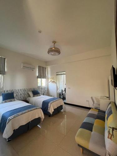 Postel nebo postele na pokoji v ubytování Kinmen Good Friends B&B