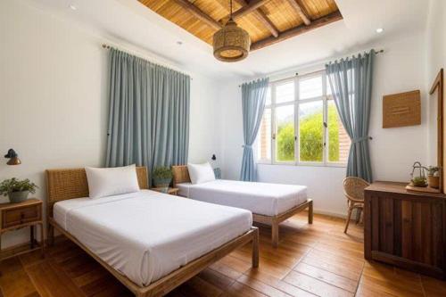 Postel nebo postele na pokoji v ubytování Gigame Signature Hotel