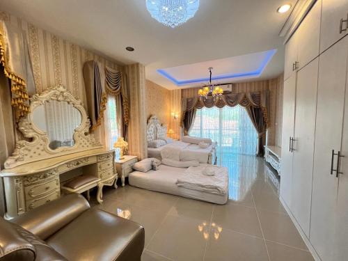 a living room with two beds and a couch at Ban MeeDee in Chiang Mai