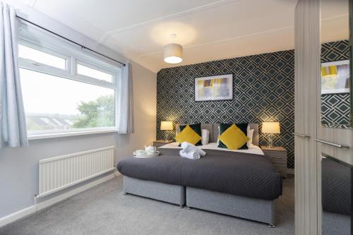 Postel nebo postele na pokoji v ubytování Taylor House, Durham