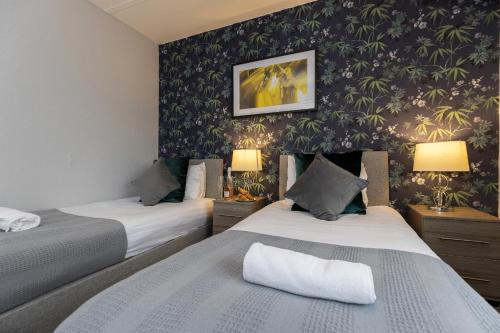 Postel nebo postele na pokoji v ubytování Taylor House, Durham