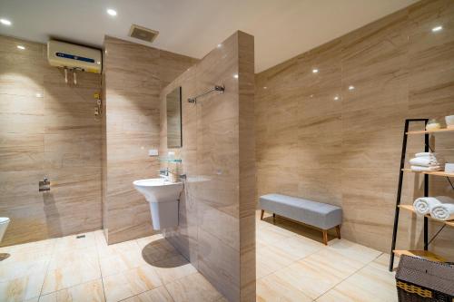 a bathroom with a toilet and a sink and a shower at WECOZY HANOI - Railway Side, The Old Quarter in Hanoi