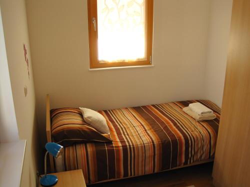 Katil atau katil-katil dalam bilik di Apartment House Cviter
