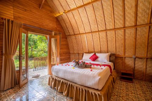 Voodi või voodid majutusasutuse Taman Bidadari Eco Wellness toas