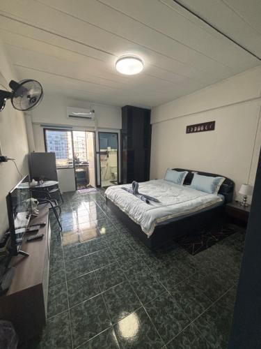 Ένα ή περισσότερα κρεβάτια σε δωμάτιο στο Monkey Apartment 7