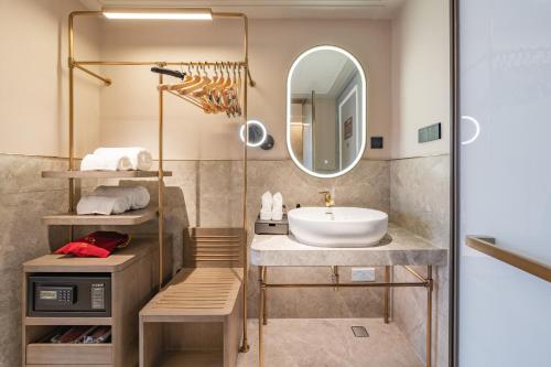 a bathroom with a sink and a mirror at Meilun Hotel Shanghai International Tourist Resort in Shanghai