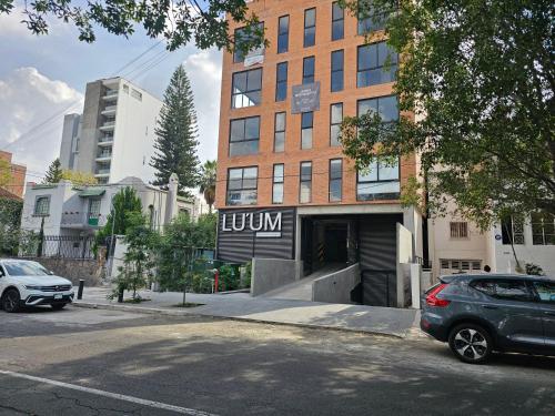 a car parked on the street in front of a building at Torre Luum by Duna Stays in Guadalajara