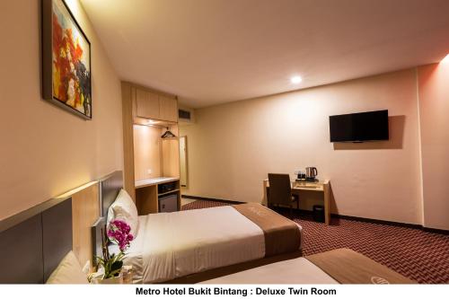 TV a/nebo společenská místnost v ubytování Metro Hotel Bukit Bintang