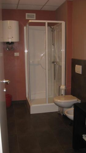 a bathroom with a shower and a toilet at Eco-Residence in Casale Monferrato