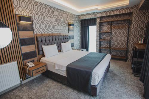 Ένα ή περισσότερα κρεβάτια σε δωμάτιο στο Prusias Otel