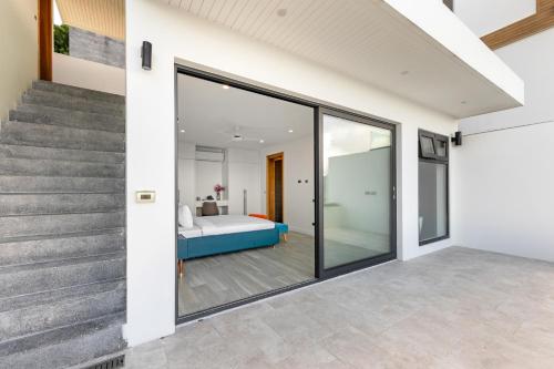 Ένα ή περισσότερα κρεβάτια σε δωμάτιο στο Chaweng Noi villa Managed by Saitara peak