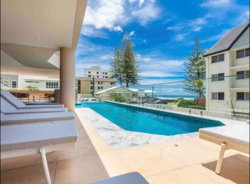 Πισίνα στο ή κοντά στο Palm Beach Paradise