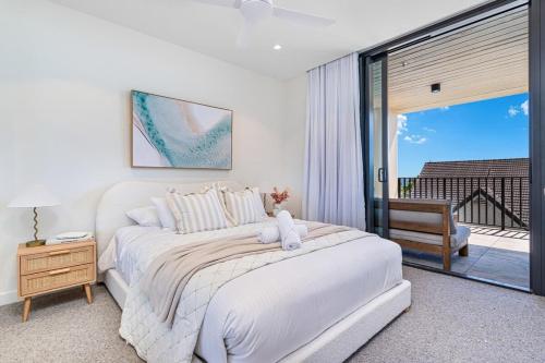Ένα ή περισσότερα κρεβάτια σε δωμάτιο στο Palm Beach Paradise