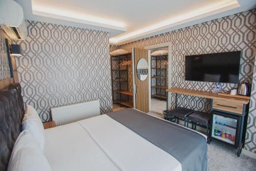 Ένα ή περισσότερα κρεβάτια σε δωμάτιο στο Prusias Otel