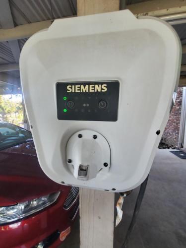 a parking meter in a garage next to a car at Wine Country Oasis Private Pool & Spa in Acampo