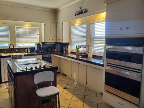 a kitchen with a counter and a stove top oven at Wine Country Oasis Private Pool & Spa in Acampo