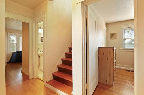 a hallway with a staircase in a home at Wine Country Oasis Private Pool & Spa in Acampo