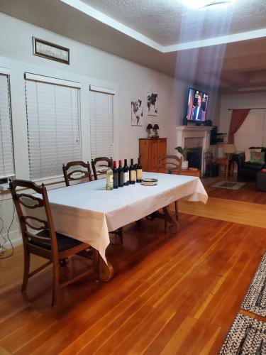 a dining room table with a white table cloth on it at Wine Country Oasis Private Pool & Spa in Acampo