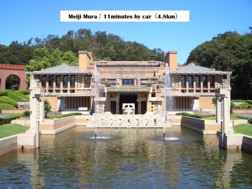 a building with a pool of water in front of it at 犬山城に近い大人数宿泊が可能で駐車場あり in Inuyama