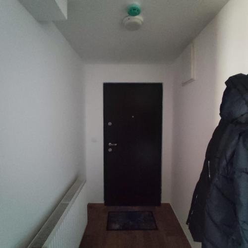 a room with a black door and a black door sidx sidx sidx at Fortuna Royal in Kopaonik