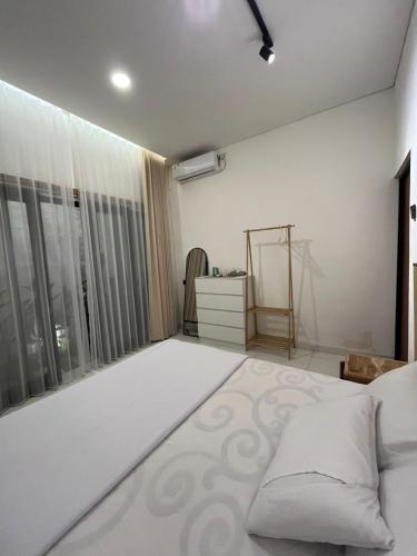 Ένα ή περισσότερα κρεβάτια σε δωμάτιο στο Adam Homestay