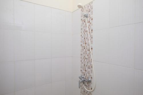 Koupelna v ubytování Sans Hotel Beskalan Malioboro