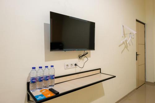 TV a/nebo společenská místnost v ubytování Sans Hotel Beskalan Malioboro