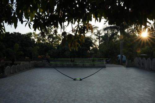 Tenis a/nebo squash v ubytování 3Acres Resorts Dehradun nebo okolí