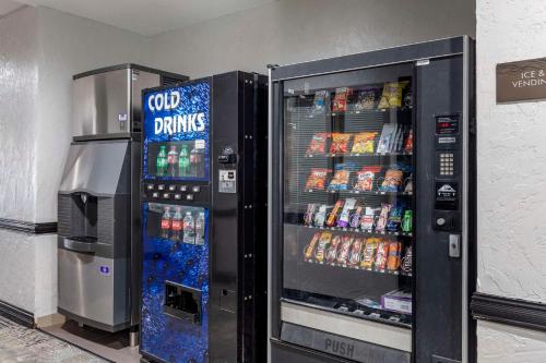 two vending machines with soda and drinks in them at Quality Inn & Suites I-35 E-Walnut Hill in Dallas